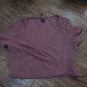 dark pinkish brownish v-neck shirt.